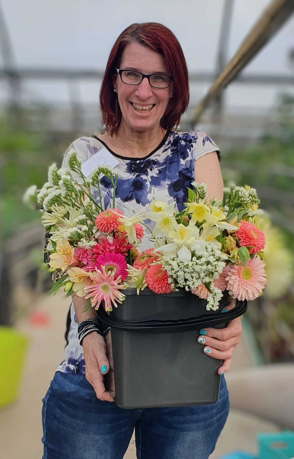 Amanda Rothery holding a bucket of freshly picked flowers