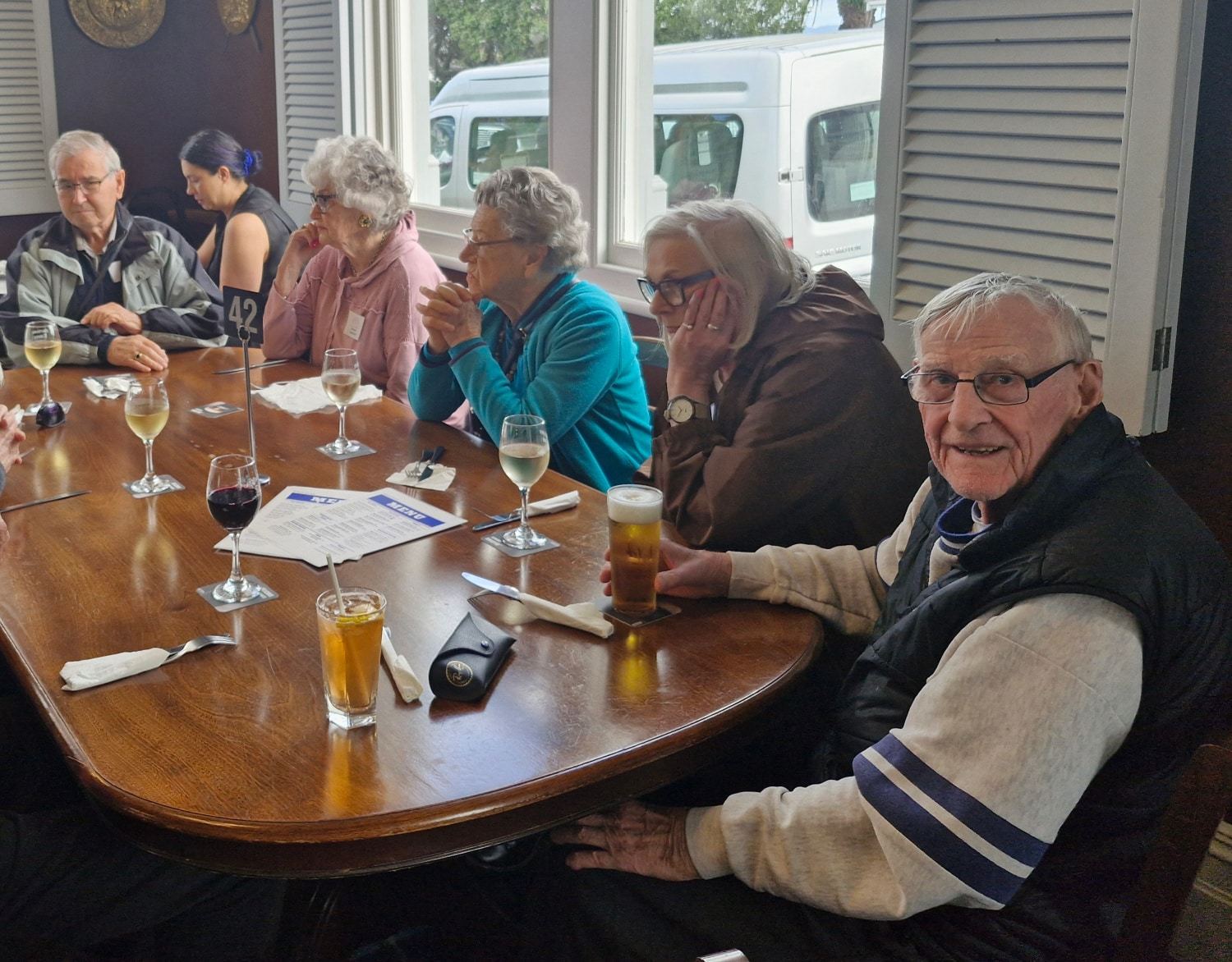 Guests laughing together over lunch